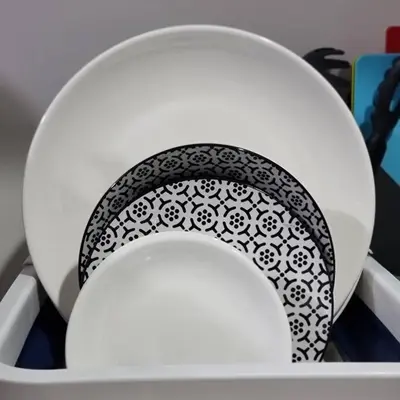 a white toilet seat with a black and white pattern on it at UNIT 4765 AIR in Manila
