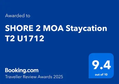 a screenshot of a cell phone with the words moza suspension at SHORE 2 MOA Staycation T2 U1712 in Manila