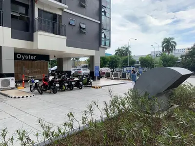 a group of motorcycles parked outside of a building at SHORE 2 MOA Staycation T2 U1712 in Manila