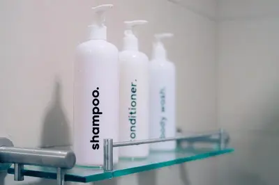 a shelf with four bottles of bleach on it at Homey 1Bedroom BGC Condo - MINIMUM 2 Nights stay in Manila
