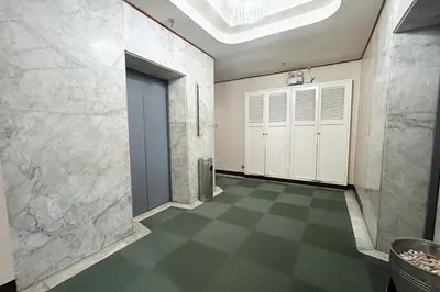 a room with a hallway with a door and a floor at Sunette Tower Suites Makati City Center in Manila