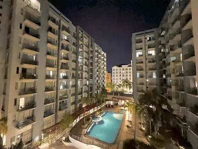 an overhead view of a swimming pool in front of buildings at Newport Hotel near NAIA Manila Airport Terminal Pasay in Manila