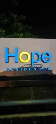 a sign for the hop intercontinental at Auberge Condotels at SMDC Hope Residences in Trece Martires