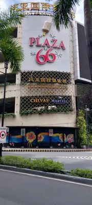a building with a sign for a pizza company at Alps Guesthouse at 150 Newport Blvd near T3 in Manila