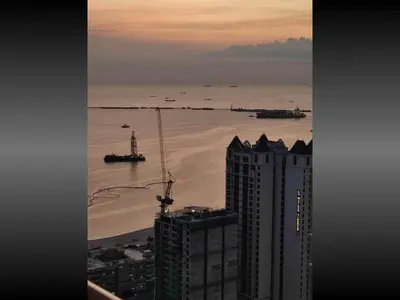 a view of the ocean from a building at Near US Embassy x Free Unlimited POOL, MASSAGE & SAUNA Access x Promo This Month! Explore Deluxe Studio w Balcony in Manila Perfectly Situated Near NAIA Airport, Heart of Manila Updated 2025 Price for Your Unforgettable Ultimate Staycation Experience in Manila