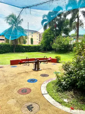 a playground in a park with a swing at RK Maisson Roiyale Pasig in Manila