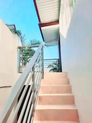 a stairway leading up to a building with a railing at Mountain View in Binangonan