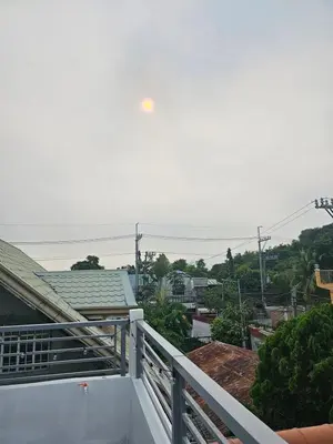 a view of the ocean from the balcony of a house at Mountain View in Binangonan