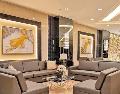 a large living room with couches and a table in it at Cozy New 1BR Fame Residences Condo with Balcony in Manila