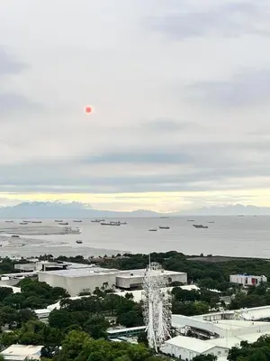 a view of a city and a body of water at CozyCoastStay by APPLETRAVELBEYONDPH in Manila