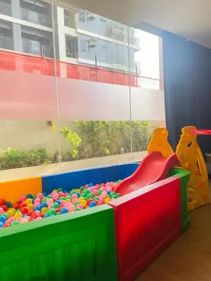 a colorful play room with a heap of balls at Deluxe Room w/ Pool & Billiards in Manila