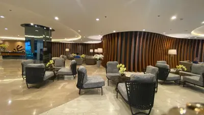 a lobby with a waiting room with chairs and tables at Stay COZY and BOUJEE in Manila