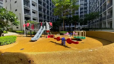 a playground with a slide in a city at Stay COZY and BOUJEE in Manila