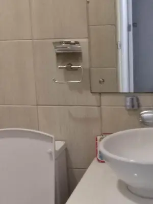 a bathroom with a white toilet and a sink at Need Place To Stay Booked Now Manila with Balcony Sea View, Promo Discount, Free Pool Plus Free Sauna Access Steps Away US Embassy, Updated 2026 Prices - Hurry Limited Time Only in Manila