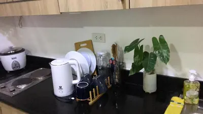 a kitchen counter with a counter top with appliances on it at Shore residences Ph in Manila