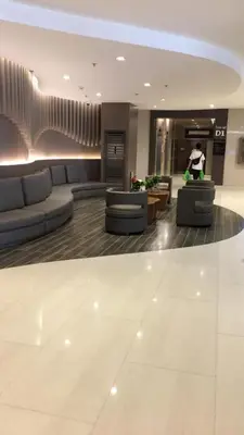 a lobby with couches and chairs in a building at Shore residences Ph in Manila