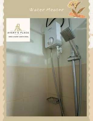 a shower in a bathroom with a shower head at Avery's Place SMDC CHARM in Manila