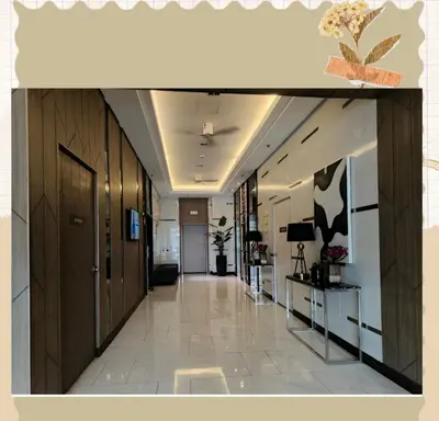 an office corridor with a hallway with wooden walls at Avery's Place SMDC CHARM in Manila