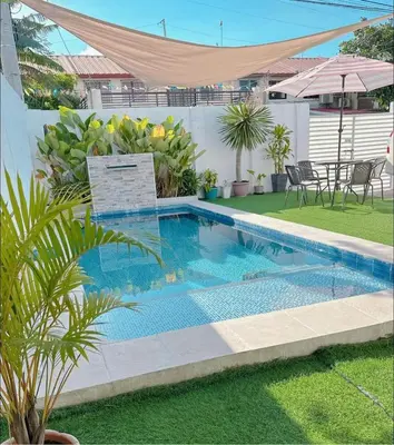 a swimming pool in the yard of a house at Sönmez Private Villa in Cavite