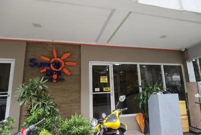 a scooter parked in front of a store at Sunny Day Residences Cainta in Cainta