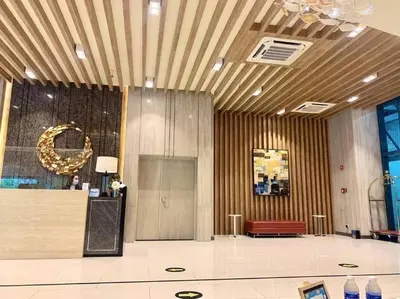 a room with a lobby with a couch and a table at LuxeStaysMnl Coastal Chic Netflx 380MBPS Pool BGC in Manila