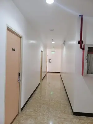 a hallway of an empty room with a door at Meaco Royal Hotel - Biñan Laguna in Biñan