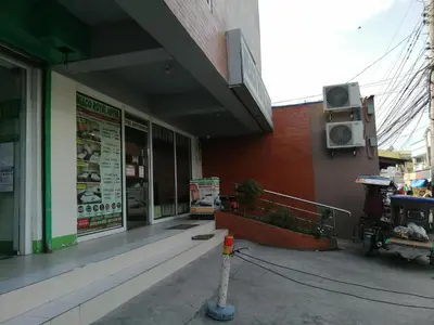 a building with a sign on the side of it at Meaco Royal Hotel - Biñan Laguna in Biñan