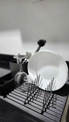 a strainer sitting on top of a drying rack at The New Villa at Sea Residences in Manila