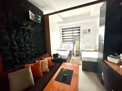 a small living room with a couch and a table at M&Ms Place in Dasmariñas