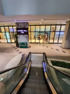 an empty mall with escalators in a shopping mall at LUXESTAYSMNL ELEGANT FAMILY 2BR SUITE POOLGYM 400MBPS WIFI NETFLX AMAZING CITY VIEW in Manila