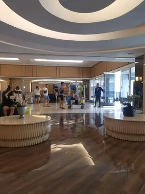 a lobby with people walking around in a building at Shell Residences 2BR & 2CR 101D in Manila