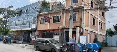 a car parked in front of a building at Aladino Hostel in Dasmariñas
