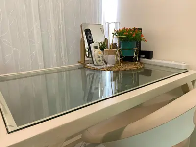 a glass table with some items on top of it at Avida Towers New Manila near Crame, Cubao and Greenhills in Manila