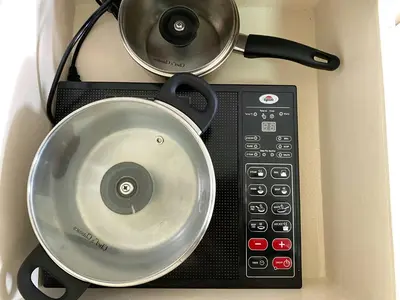 a pot sitting on top of a microwave at Avida Towers New Manila near Crame, Cubao and Greenhills in Manila