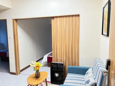 a living room with a couch and a bedroom at Beachfront U.S. Embassy Family Retreat. in Manila