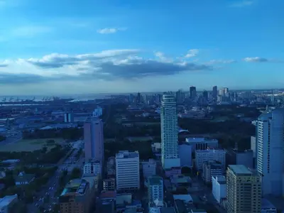 an aerial view of a city with tall buildings at Beachfront U.S. Embassy Family Retreat. in Manila
