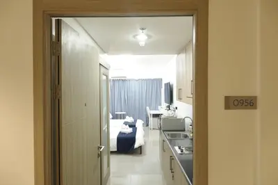 a view of a room with a bed and a bathroom at NAIA Airport 956 DYNASTEL SHORE Staycation in Manila