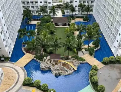 an aerial view of the pool at the resort at MOA Arena 1155 CONDOTEL DYNASTEL SHORE in Manila