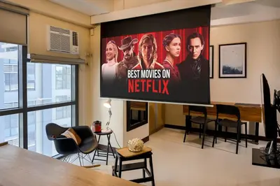 a large screen in a living room with a tv at Max Dwell Bgc Creative Space with 84 