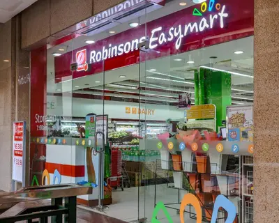 a store with a glass window in a mall at Max Dwell Bgc Creative Space with 84 