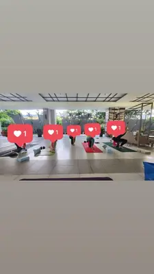 a row of red chairs in an airport terminal at Brand new condo for travelers in Paranaque near airport in Manila