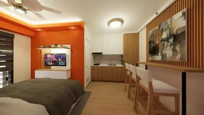 a bedroom with orange walls and a kitchen with a bar at Near Manila Airport, MAILZ HOMEZ COZY Hotel Style Studio Condo, Avida Towers Sucat, Full Kitchen, Swimming Pool, WIFI, 5G in Manila
