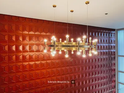 a chandelier hanging in front of a red wall at Perfect for Working, Quiet & Relaxing at Uptown BGC in Manila