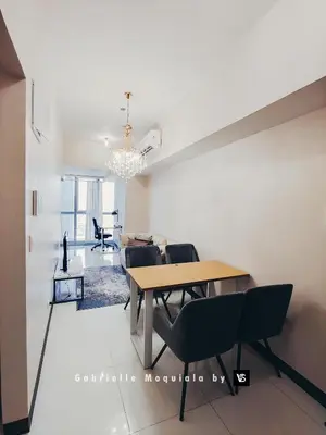 a dining room with a table and chairs at Perfect for Working, Quiet & Relaxing at Uptown BGC in Manila