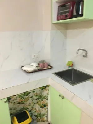 a small kitchen with a sink and a sink at AGB Anchorage Inn, studio room - 2 single beds in Manila