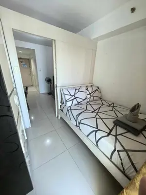 a bedroom with a large bed in a room at BH Crib - Staycation near Mall of Asia Complex in Manila