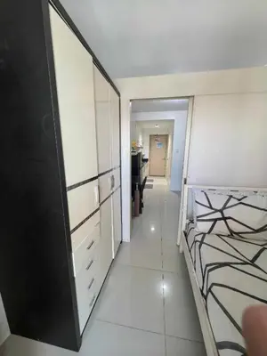 a room with a bed and a mirror in it at BH Crib - Staycation near Mall of Asia Complex in Manila