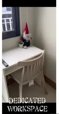 a desk with a santa hat on top of it at Cozy Private Condo at Shore 3 near MOA in Manila