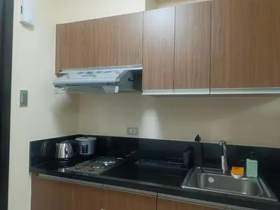 a kitchen with a sink and a counter top at The Radiance Manila Bay Studio 2 in Manila