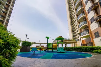 a playground in a courtyard between two buildings at The Radiance Manila Bay Studio in Manila